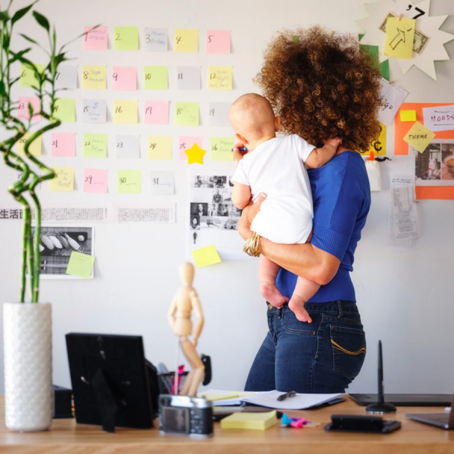 Female creative professional balancing freelance work with family care.